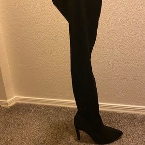 Thigh high black boots